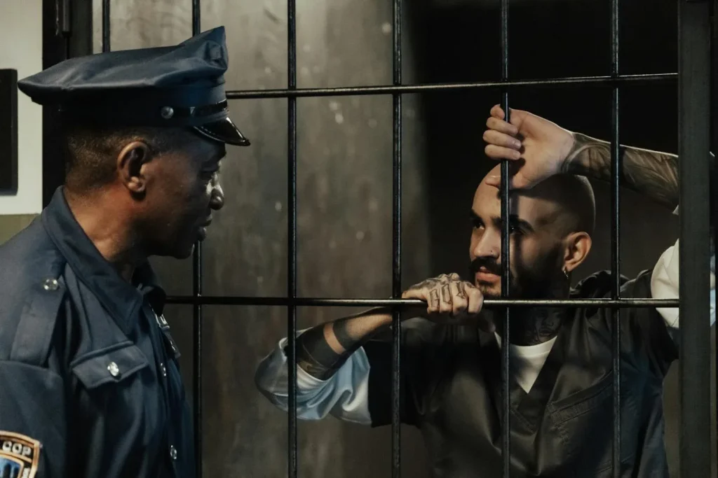 Policeman talking to prisoner