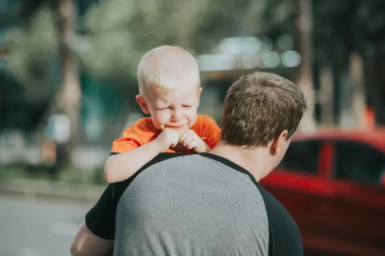 Man taking his child away