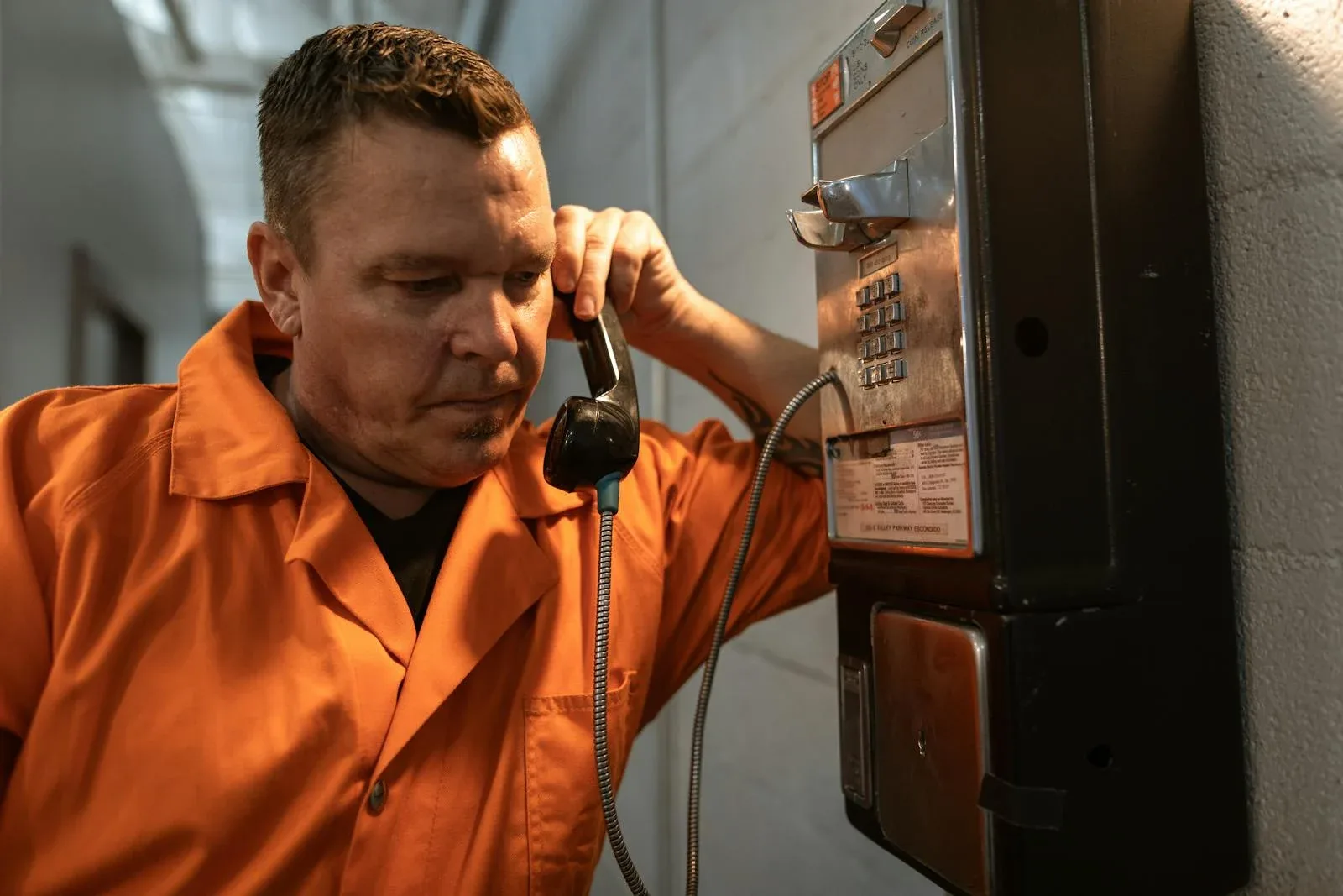 Man making phone call from prison