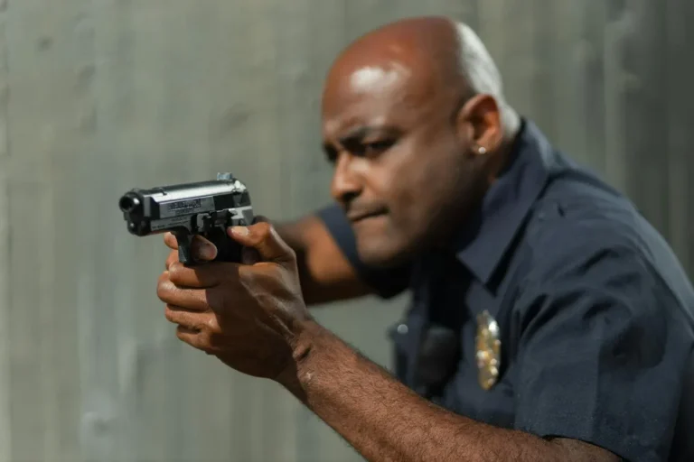 Police officer using his gun