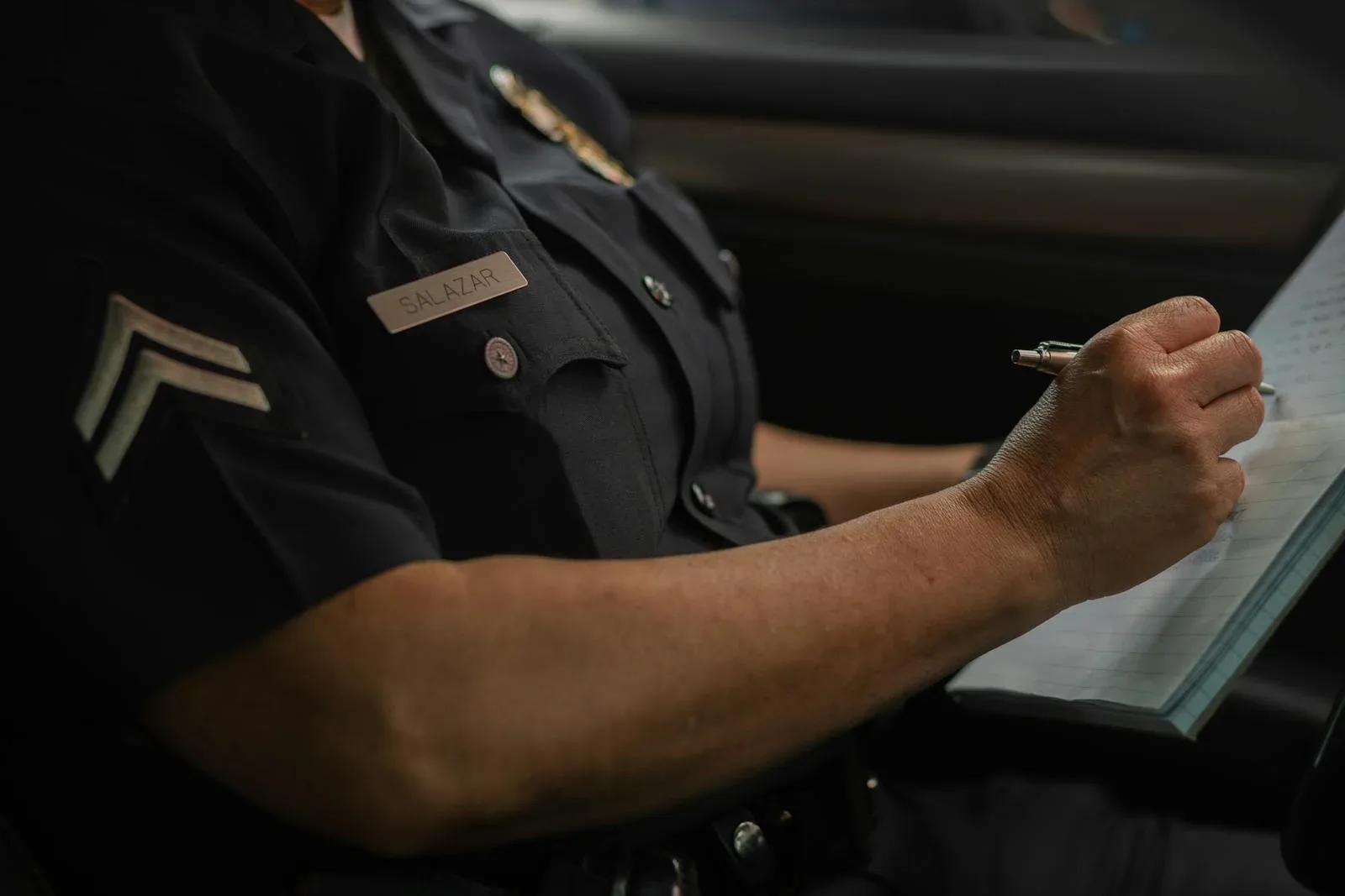 Police Officer Writing a Fine Ticket