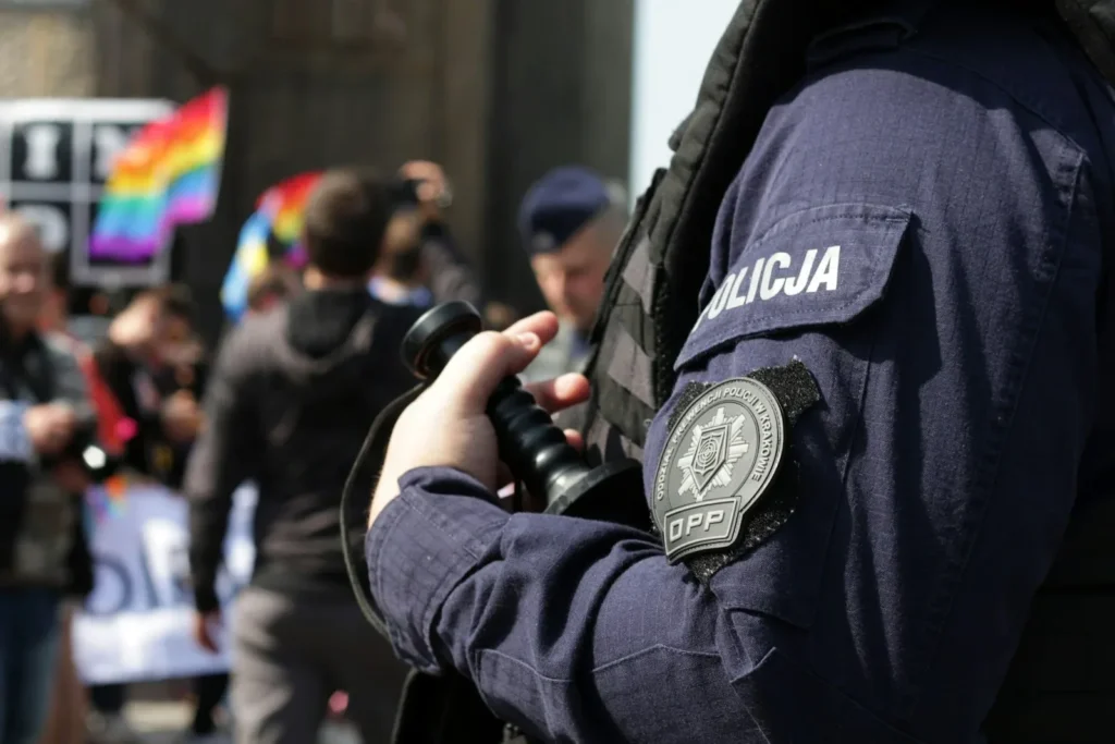 Police officer standing in front of a crowd of people