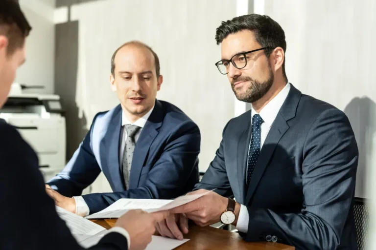 Divorce lawyer showing documents to his client