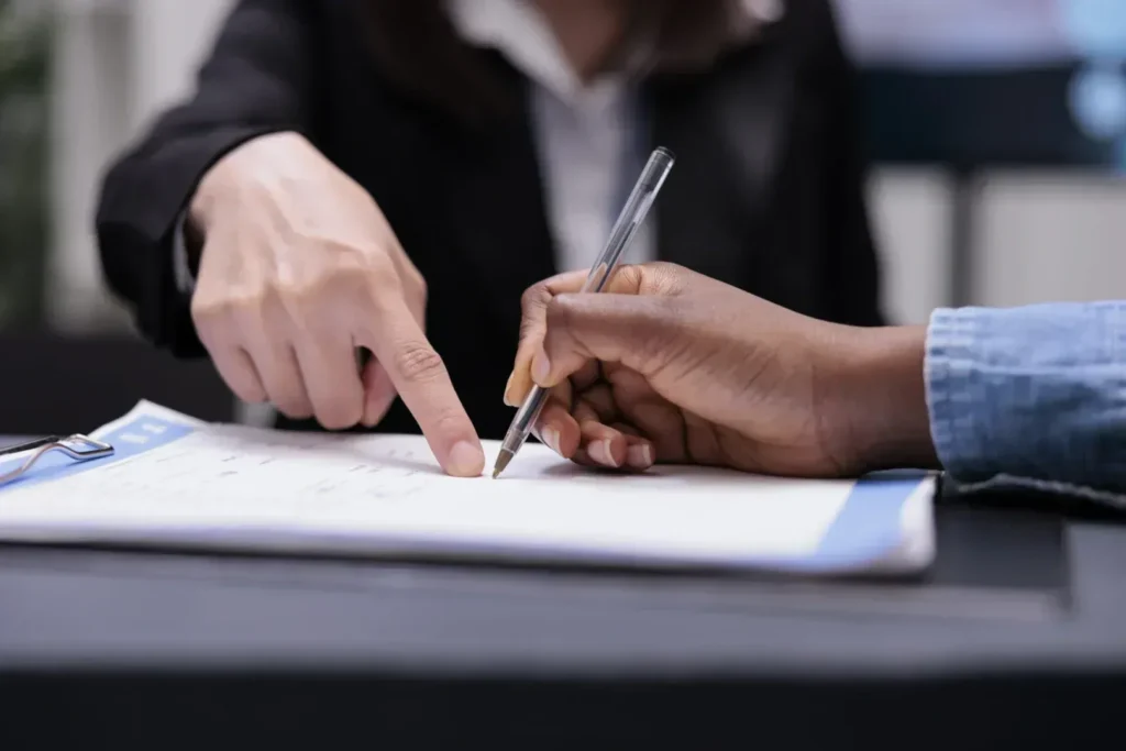 Woman signing divorce forms