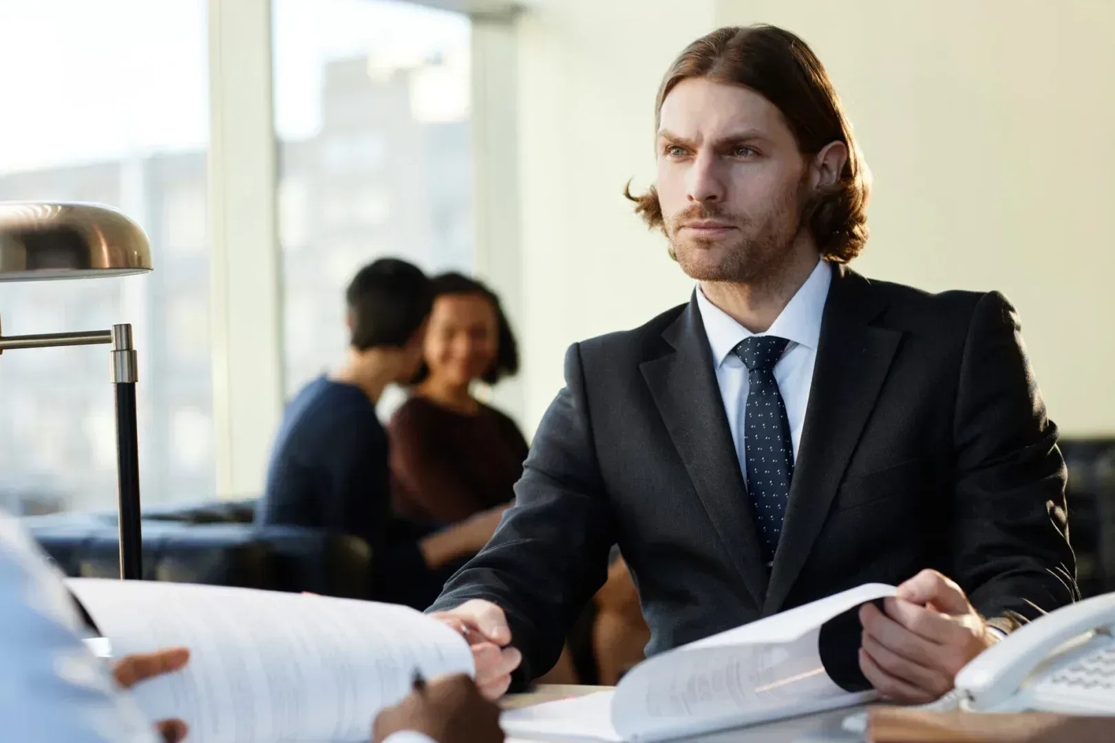 Lawyer showing divorce documents to his client