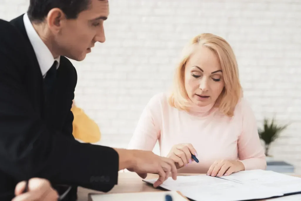 Woman signing divorce papers