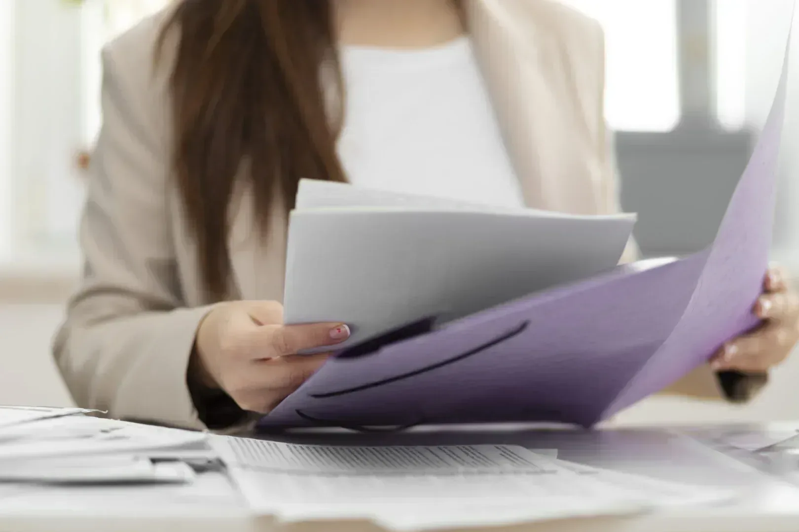 Woman looking through divorce papers